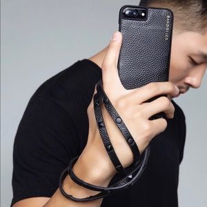 Bandolier iPhone plus case with studded strap.